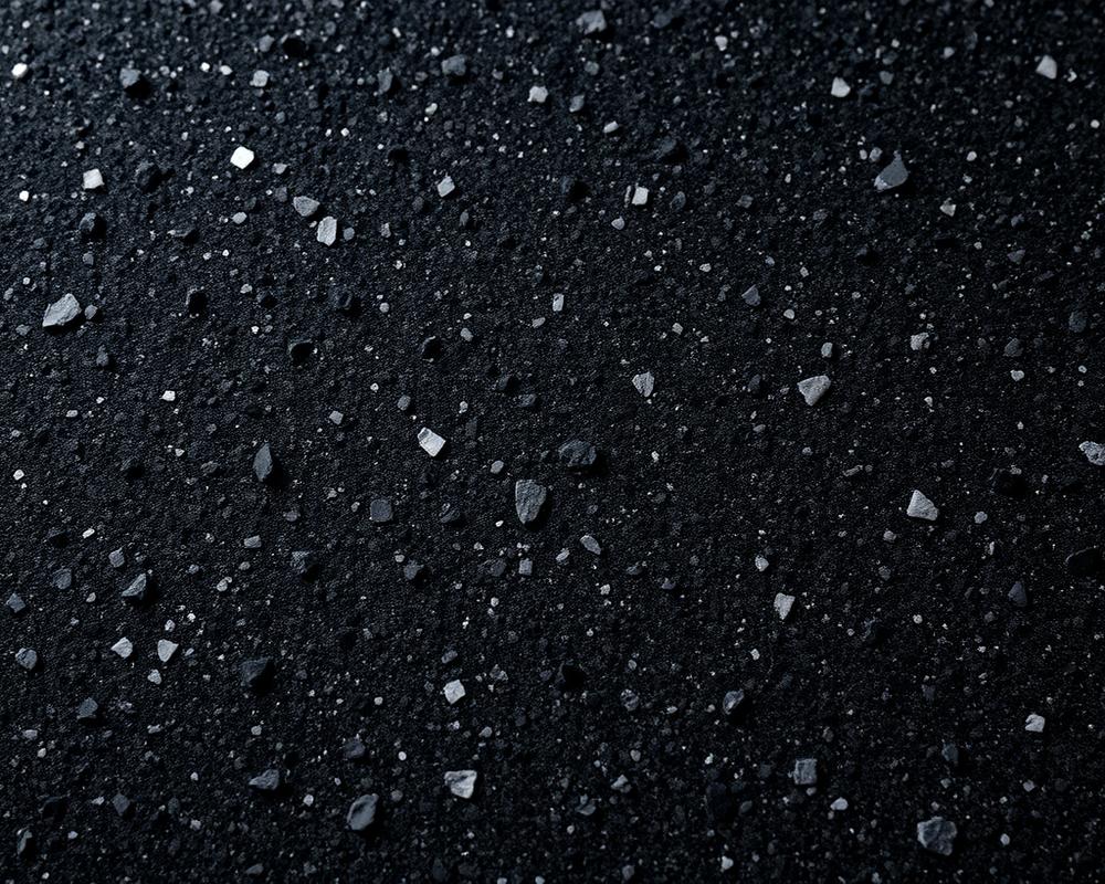 Close-up texture of a shot-blasted granite surface